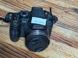 a camera that is sitting on a wooden table