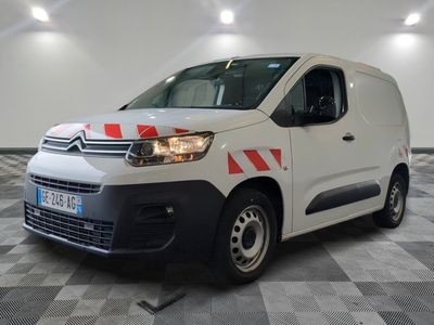 citroen van with red and white stripes parked in a large room