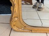 a reflection of a person in a mirror on the floor