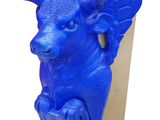 a blue sculpture of a bull with wings on it ' s head
