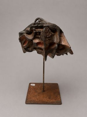 an image of a sculpture of a shell on a wooden base