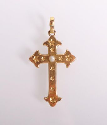 a gold cross pendant on a white background