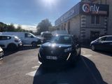 cars parked in a parking lot in front of a building