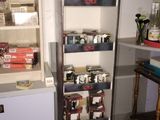 a metal rack with many items in it in a room