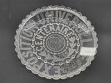 a glass plate with a circular design on it