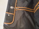 a black and brown bag with a zipper on it
