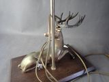 a lamp that has a deer on top of it
