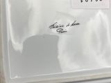 a picture of a white porcelain plate with a name on it