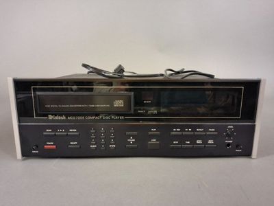 a close up of a stereo system on a white surface