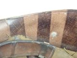 a close up of a brown and black striped chair