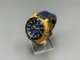 the watch is blue and gold with a black face