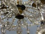 a crystal chandelier hanging from the ceiling in the room