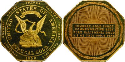 a close up of a gold coin with an eagle on it