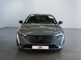 the front view of a grey car in a showroom