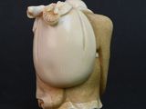 an image of a figurine of a woman holding a baby
