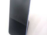 a cell phone that is sitting on top of a stand