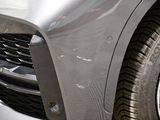 a close up of the front of a silver car