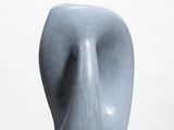 a blue sculpture on a white pedestal with a white background