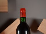 a bottle of wine that is sitting on a table