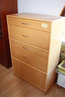 an image of a dresser in a bedroom with wood floors