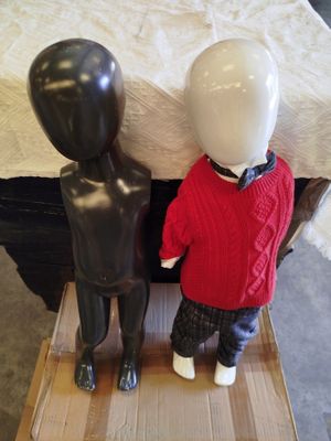 two mannequins that are standing next to each other