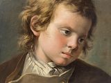 portrait of a young boy in a brown coat and white shirt