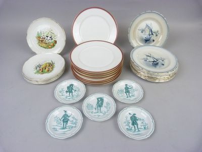 many plates and bowls that are sitting on a table