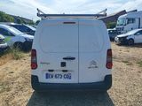 a white van that is parked in a lot
