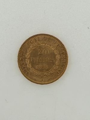 a close up of a coin on a white surface with a white background