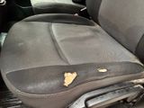 a dirty seat in the back of a car