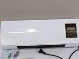 an air conditioner sitting on top of a table next to a charger