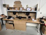 a workbench in a garage with a lot of boxes on it