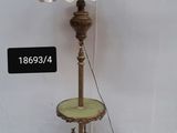 a lamp that is sitting on a table next to a wall