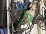 two boxes with tools in them sitting on the floor