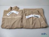 two pairs of men ' s sweatpantss sitting on top of a table