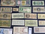 several different types of paper money laid out on a table
