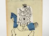 un vieux livre sur lequel figure le dessin d'un homme à cheval