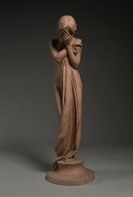 an image of a statue of a woman holding her hands to her face