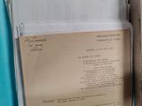 a box full of documents sitting on a table