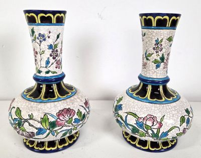 two vases that are sitting on a table