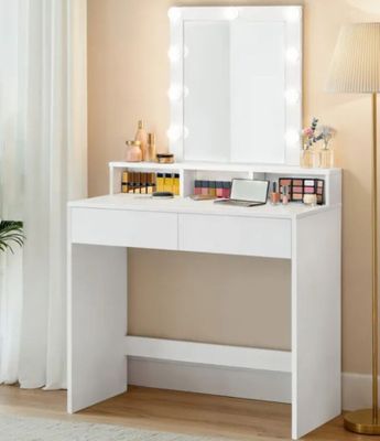 a white dressing table with a mirror on top of it