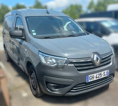 a grey van that is parked on the side of the road