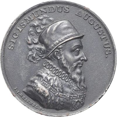 une vieille pièce d'argent à l'effigie d'un homme coiffé d'un chapeau