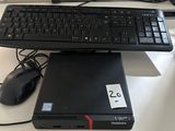 a keyboard and a mouse on a desk next to a laptop