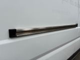 a white van that is parked on the side of the road