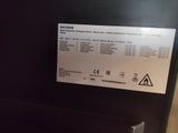 a picture of a sign on the side of a refrigerator