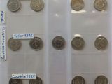 a lot of coins that are in a plastic case