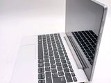 two laptops sitting side by side on a white surface