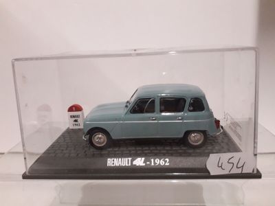 a small blue car in a display case