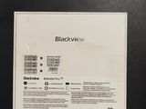 a picture of the back of a black phone